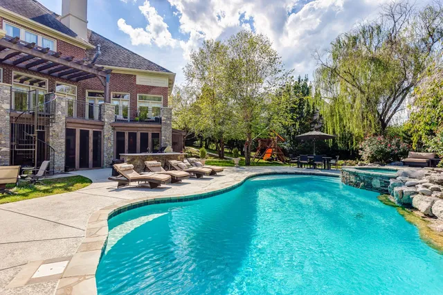 an aerial view of a house with yard