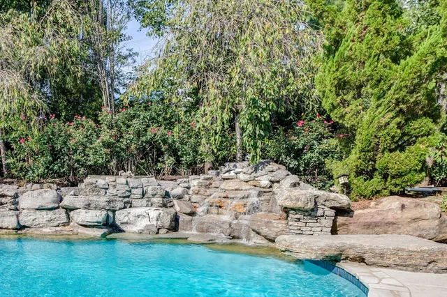a view of a house with swimming pool