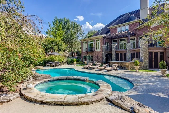 a view of a park with iron fence