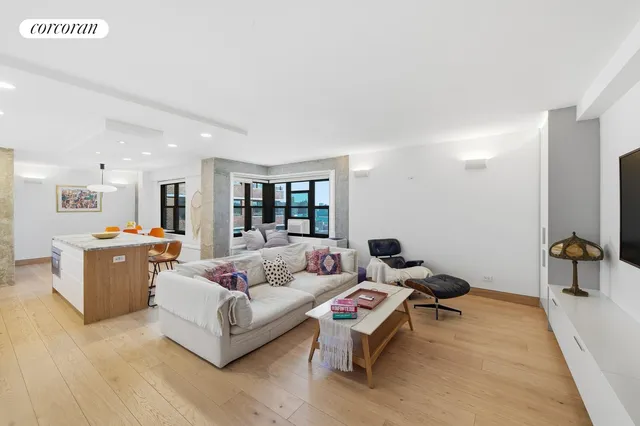 a living room with furniture and a table