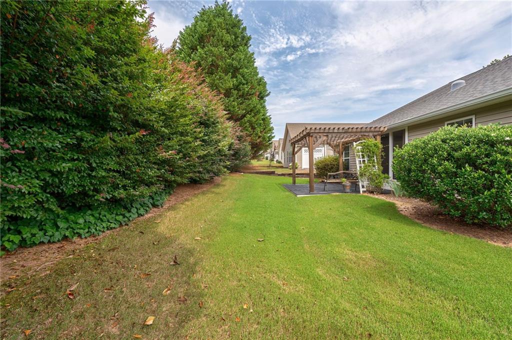 245 Memory Lane Winder, GA 30680 - Photo 40 of 62 a view of a garden with a slide