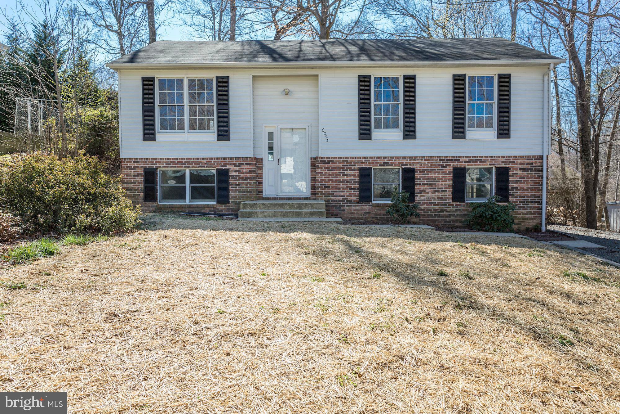 6023 Maple Road St. Leonard, MD 20685 - Photo 1 of 30 a front view of a house with a yard