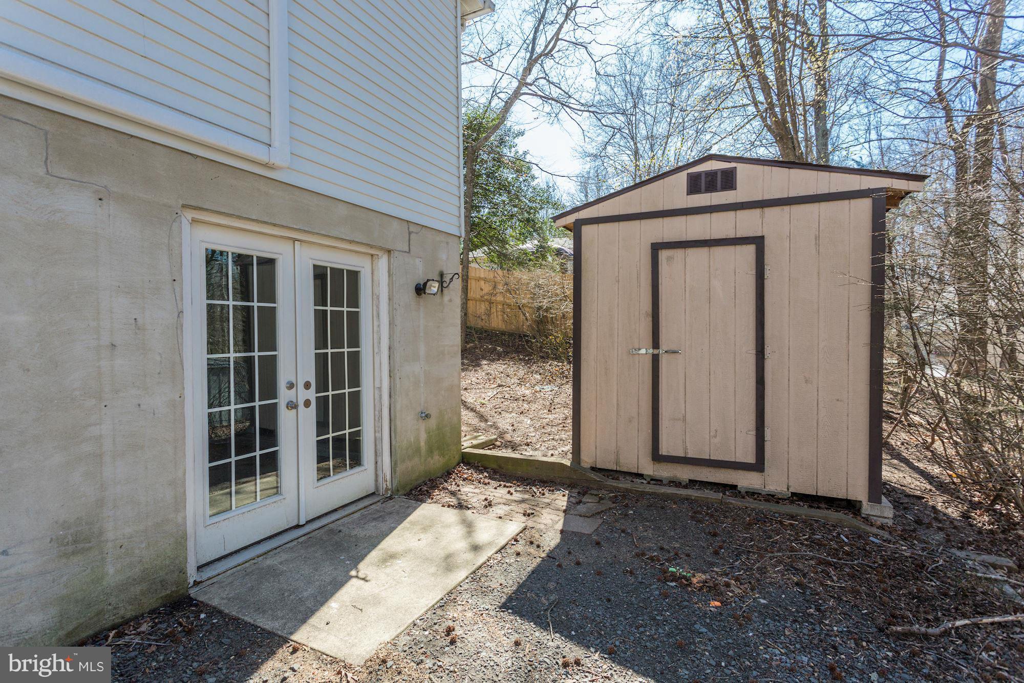 6023 Maple Road St. Leonard, MD 20685 - Photo 24 of 30 a front view of a house with a yard