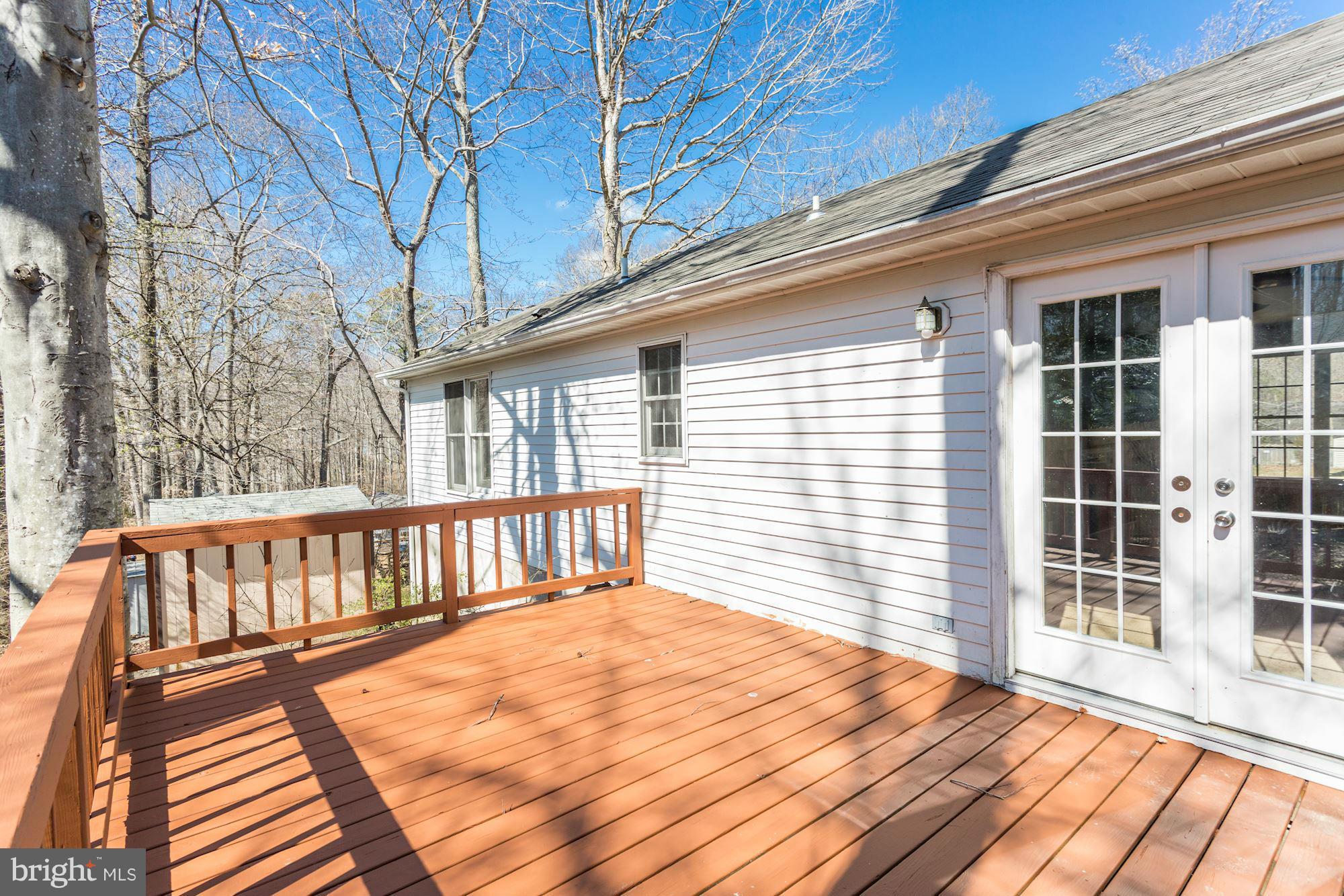 6023 Maple Road St. Leonard, MD 20685 - Photo 27 of 30 a view of wooden balcony