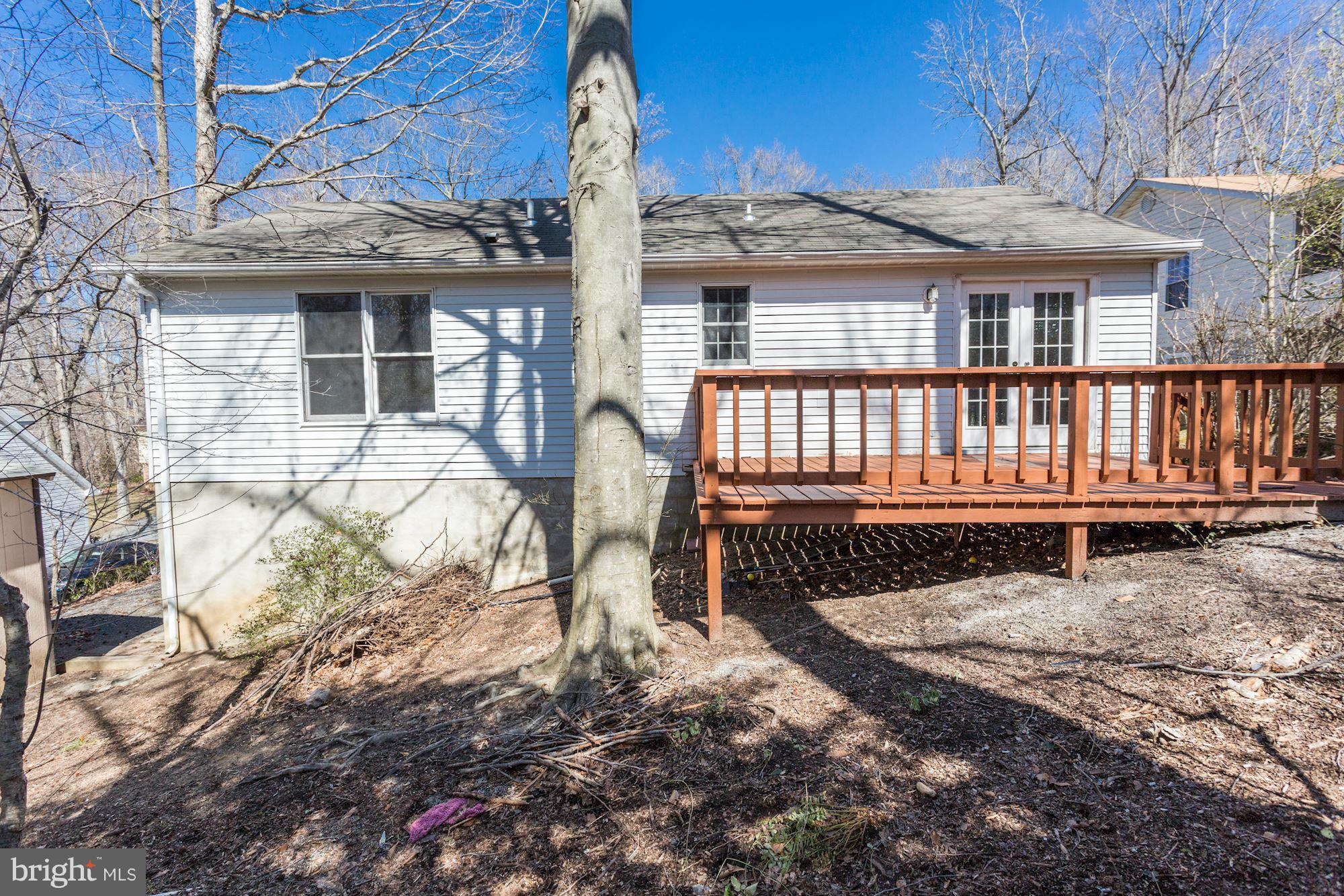 6023 Maple Road St. Leonard, MD 20685 - Photo 28 of 30 a view of a house with backyard and sitting area