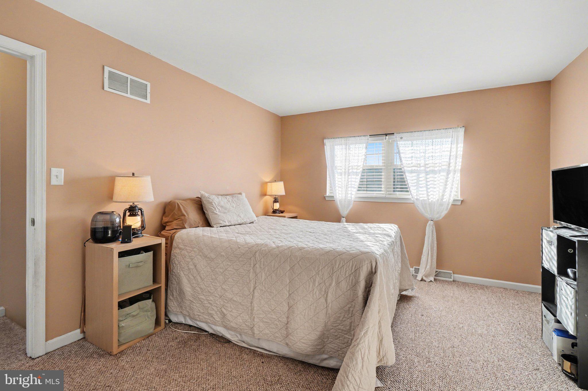 2941 Milky Way Dover, PA 17315 - Photo 13 of 26 a bedroom with a bed and a flat screen tv