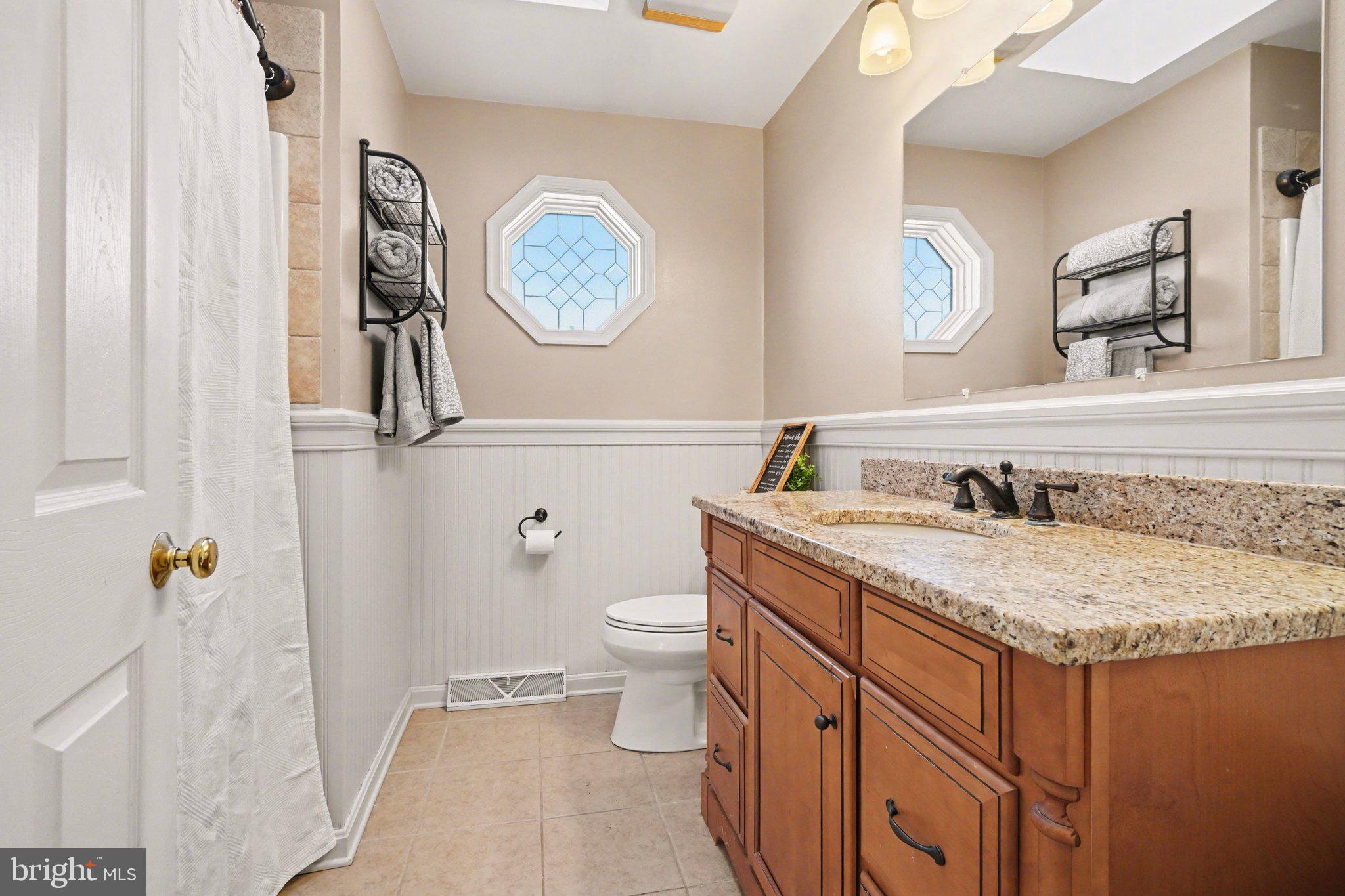2941 Milky Way Dover, PA 17315 - Photo 15 of 26 a bathroom with a granite countertop sink and a mirror