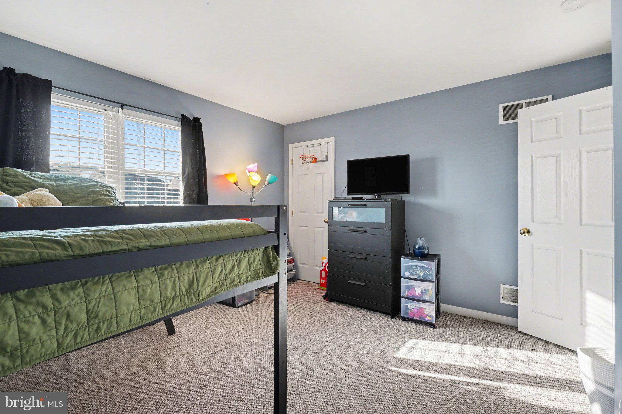 2941 Milky Way Dover, PA 17315 - Photo 17 of 26 a bedroom with a bed and a television