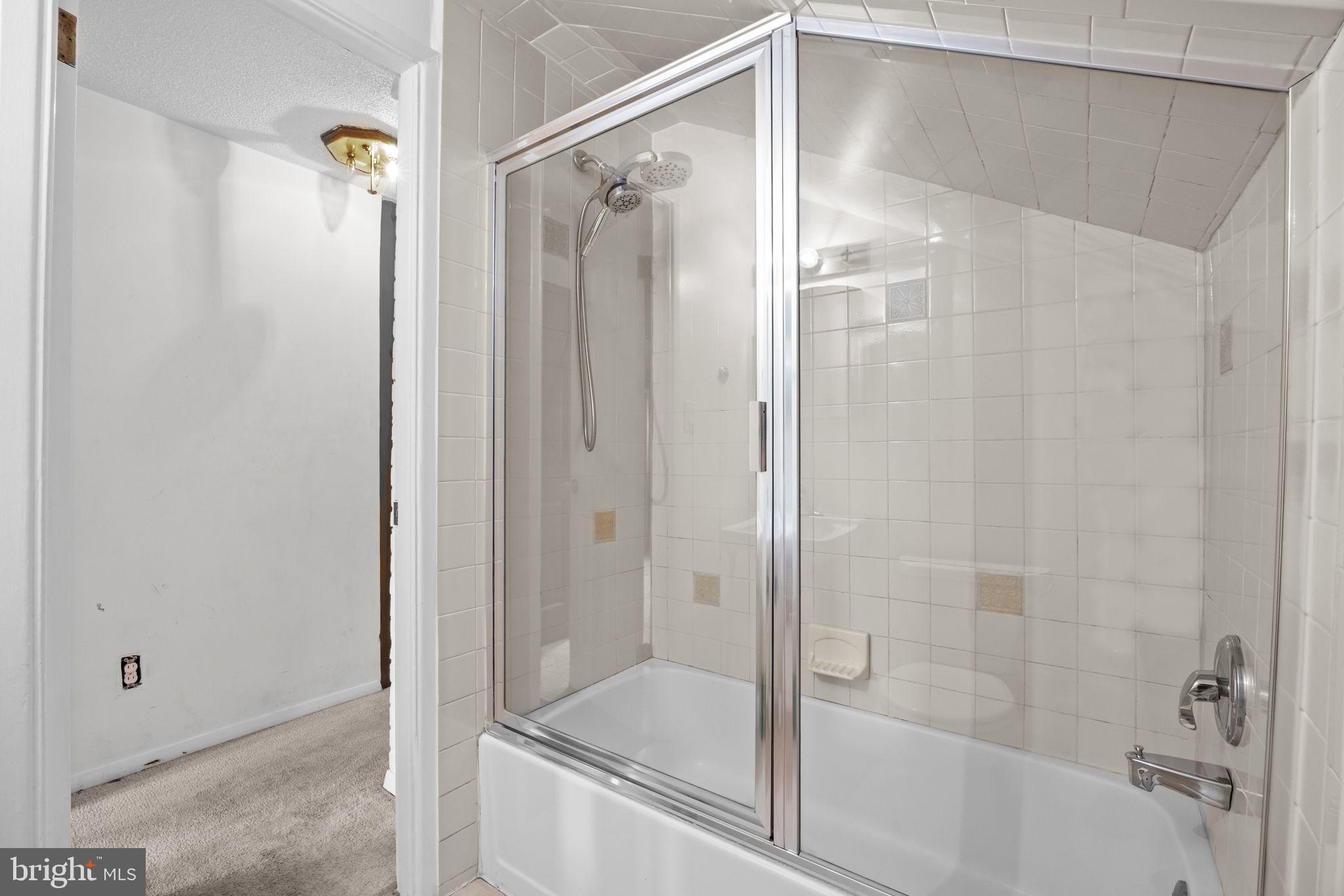 36 Grapevine Road Levittown, PA 19057 - Photo 14 of 19 a bathroom with a glass shower door