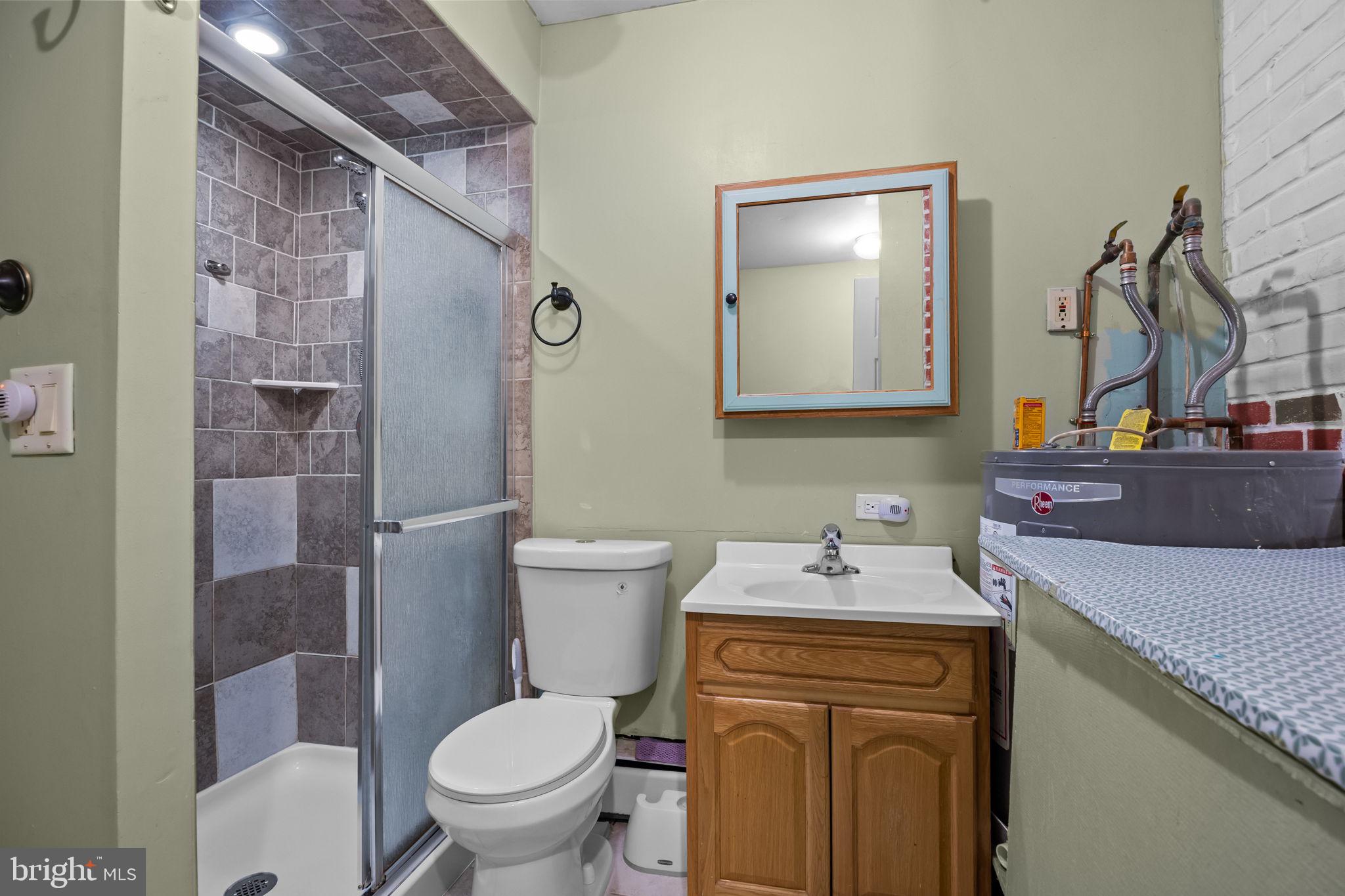 36 Grapevine Road Levittown, PA 19057 - Photo 10 of 19 a bathroom with a sink a toilet and shower