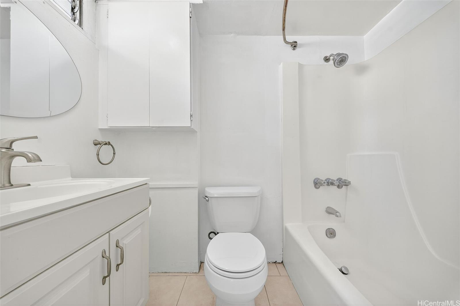 2888 Ala Ilima Street, Unit 1512 Honolulu, HI 96818 - Photo 13 of 25 a bathroom with a sink a toilet and a bathtub
