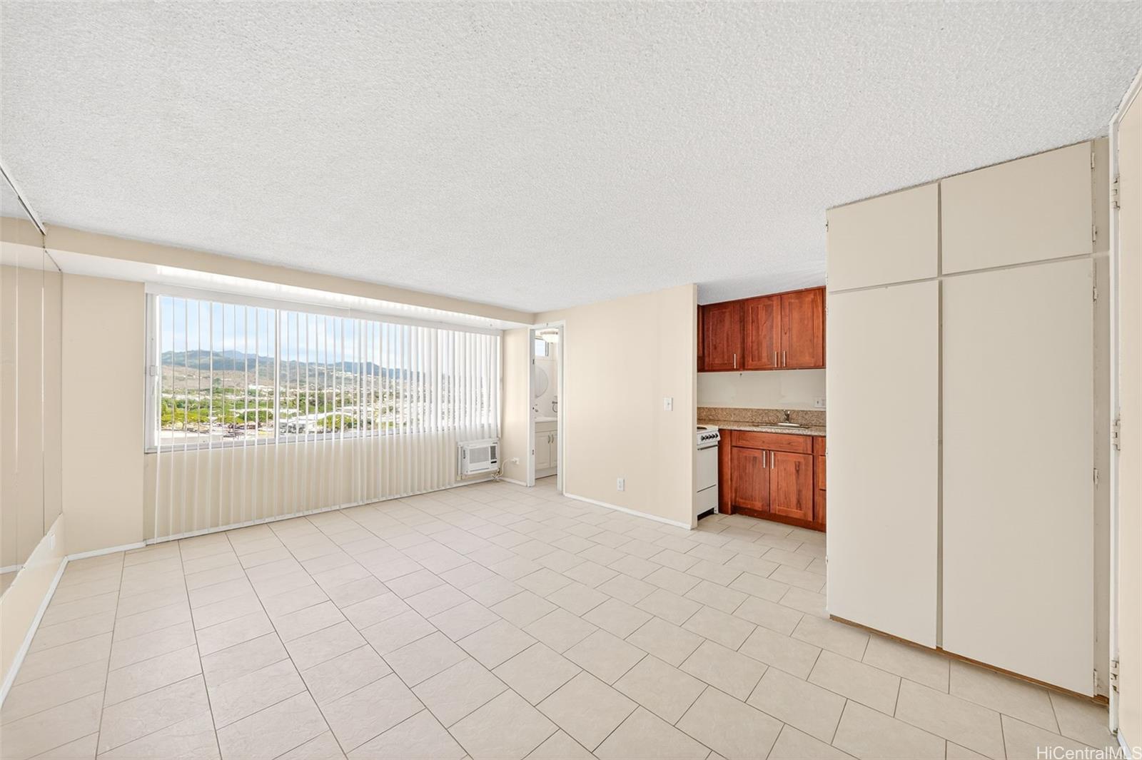 2888 Ala Ilima Street, Unit 1512 Honolulu, HI 96818 - Photo 3 of 25 a view of an empty room with a window