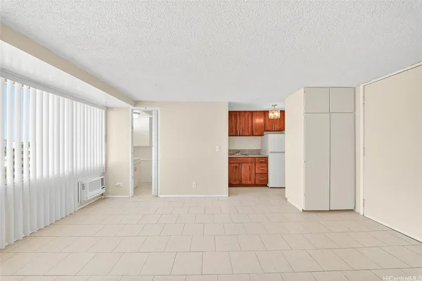 a kitchen with a white cabinets and white appliances
