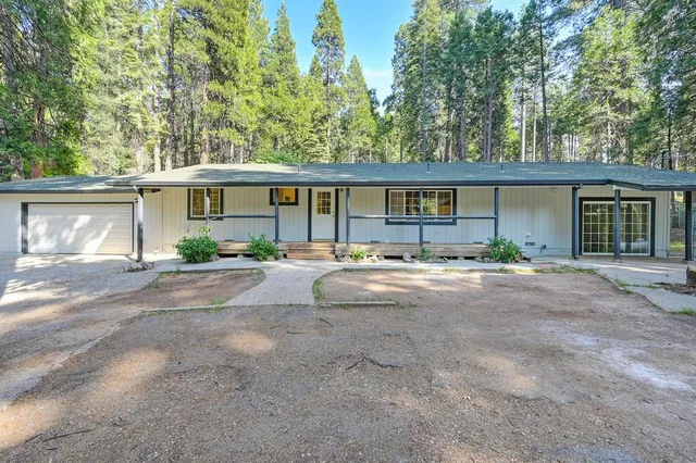 a view of house with outdoor space and front view of a house