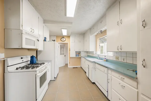 a front view of a house with outdoor seating