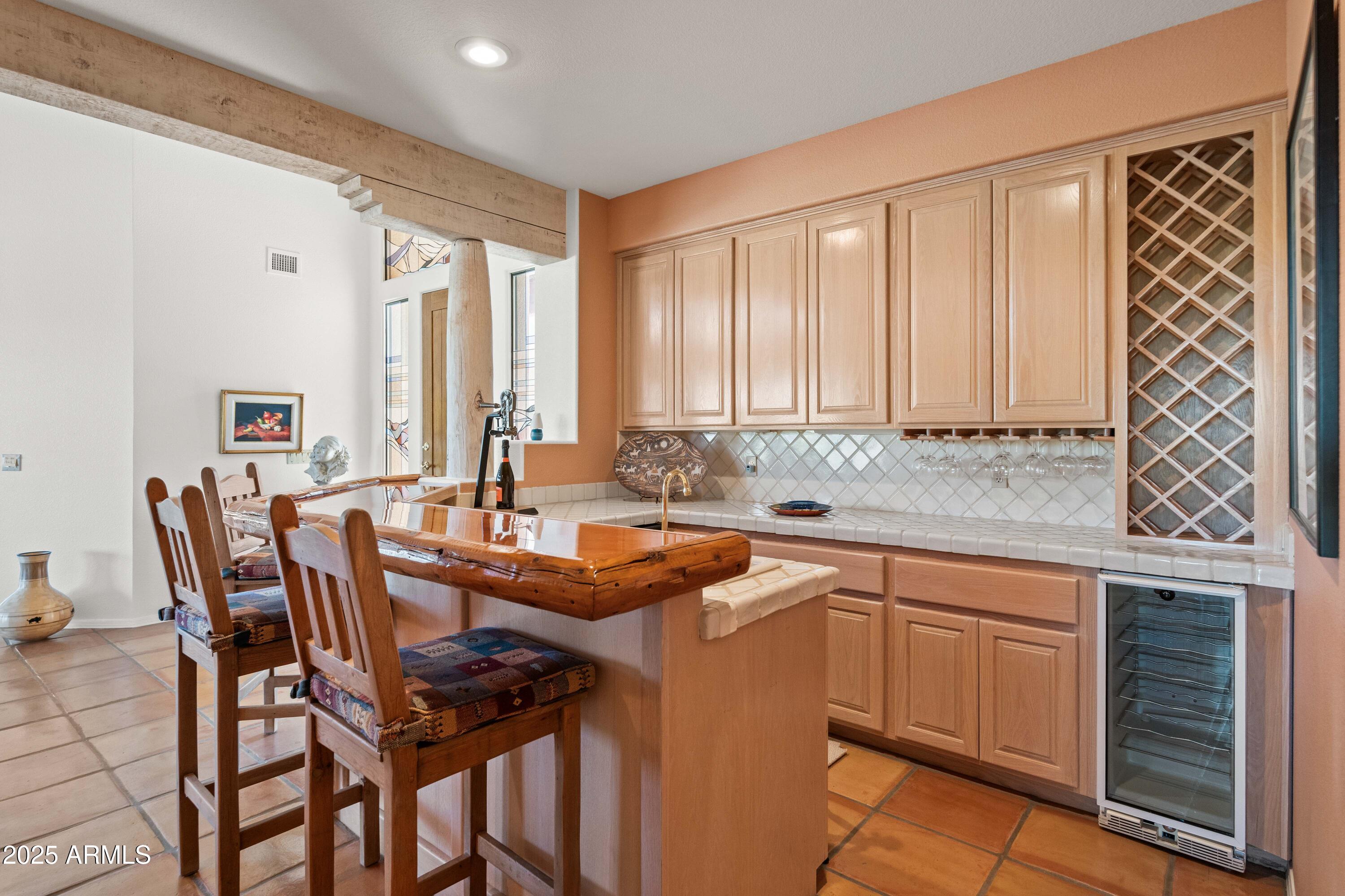 19130 East Alondra Way Rio Verde, AZ 85263 - Photo 10 of 40 a kitchen that has a sink and chairs in it