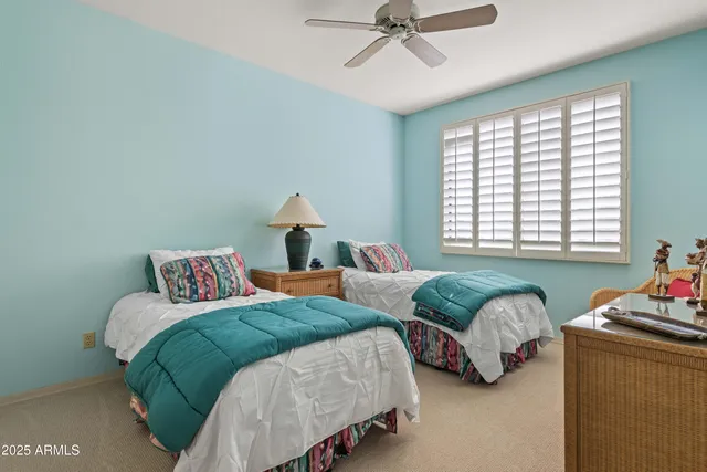 a large kitchen with a sink and cabinets