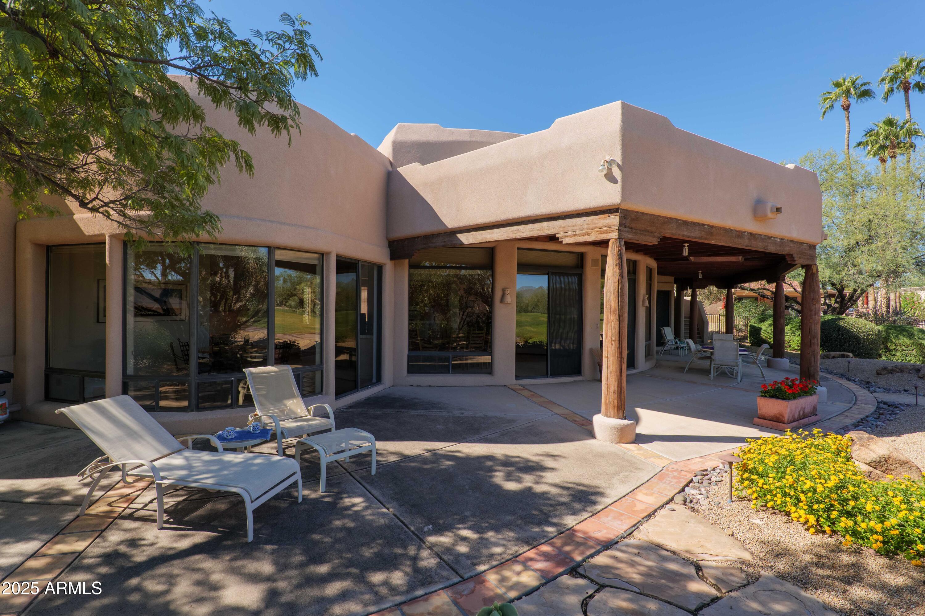 19130 East Alondra Way Rio Verde, AZ 85263 - Photo 21 of 40 a view of a chairs and table in the patio