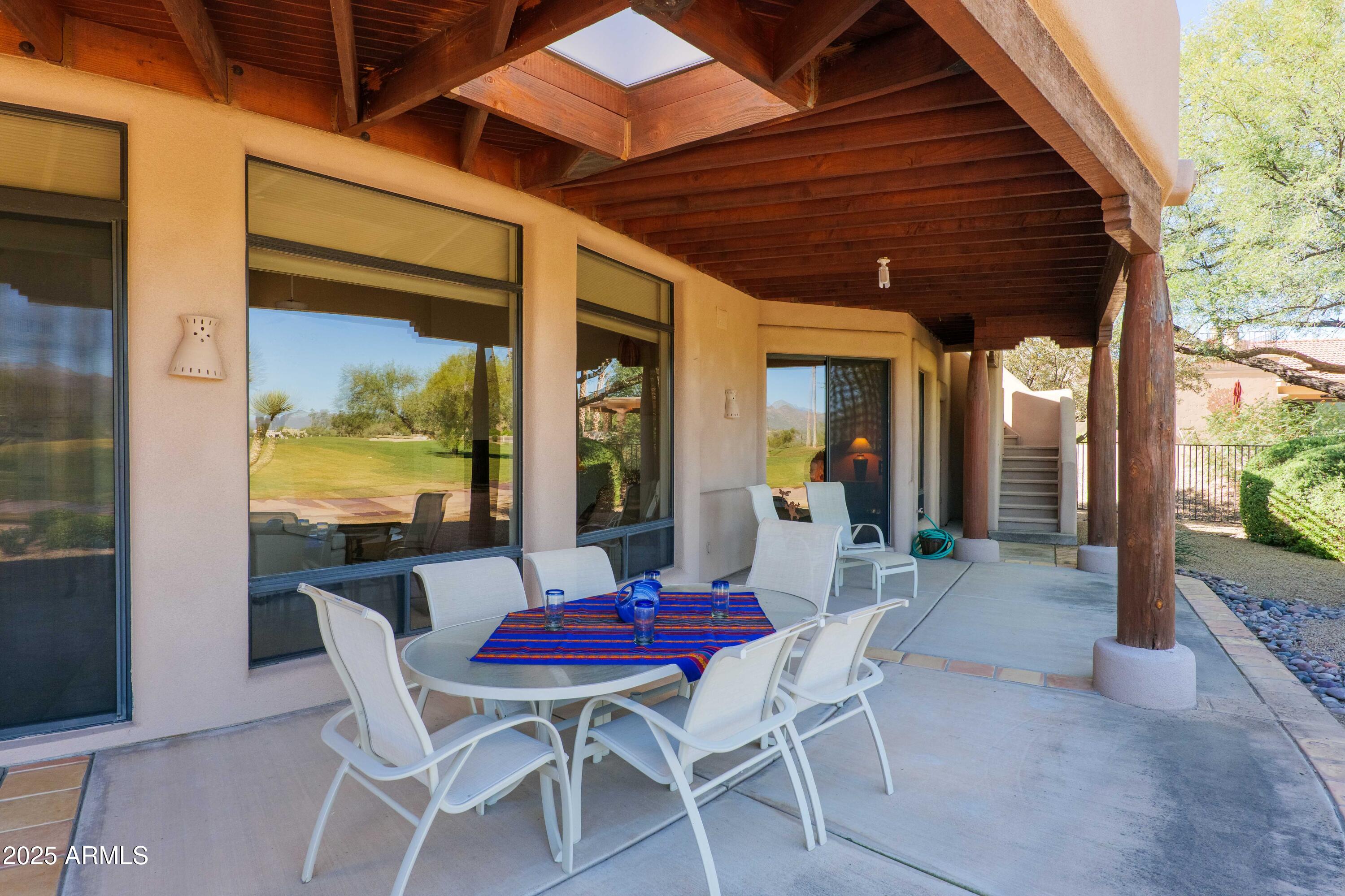 19130 East Alondra Way Rio Verde, AZ 85263 - Photo 22 of 40 a dining room with furniture and wooden floor