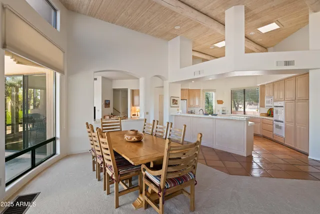 a living room with furniture fireplace and flat screen tv