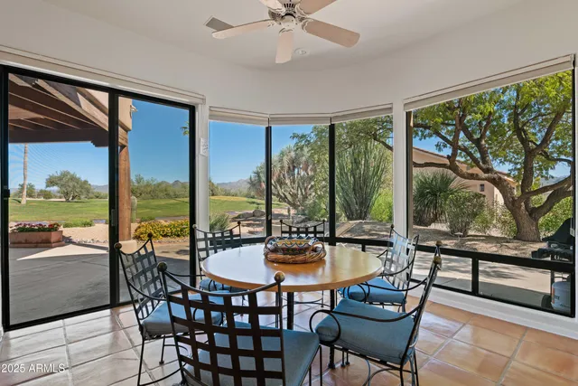 a kitchen with a sink and large windows