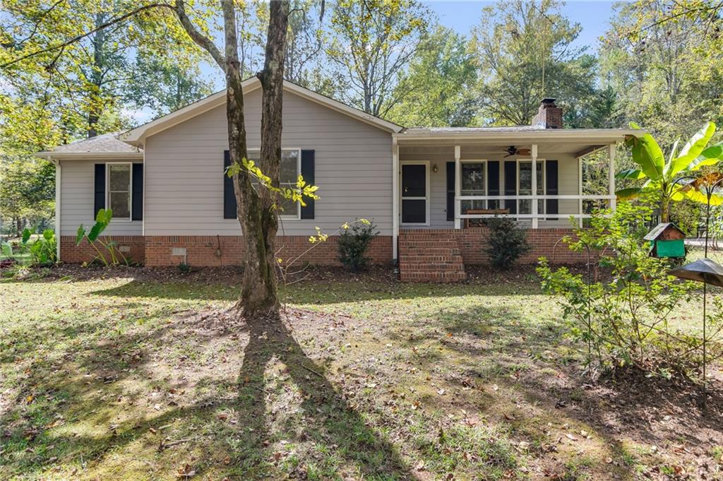 450 Baxter Road Carrollton, GA 30117 - Photo 1 of 1 a view of a house with backyard and garden