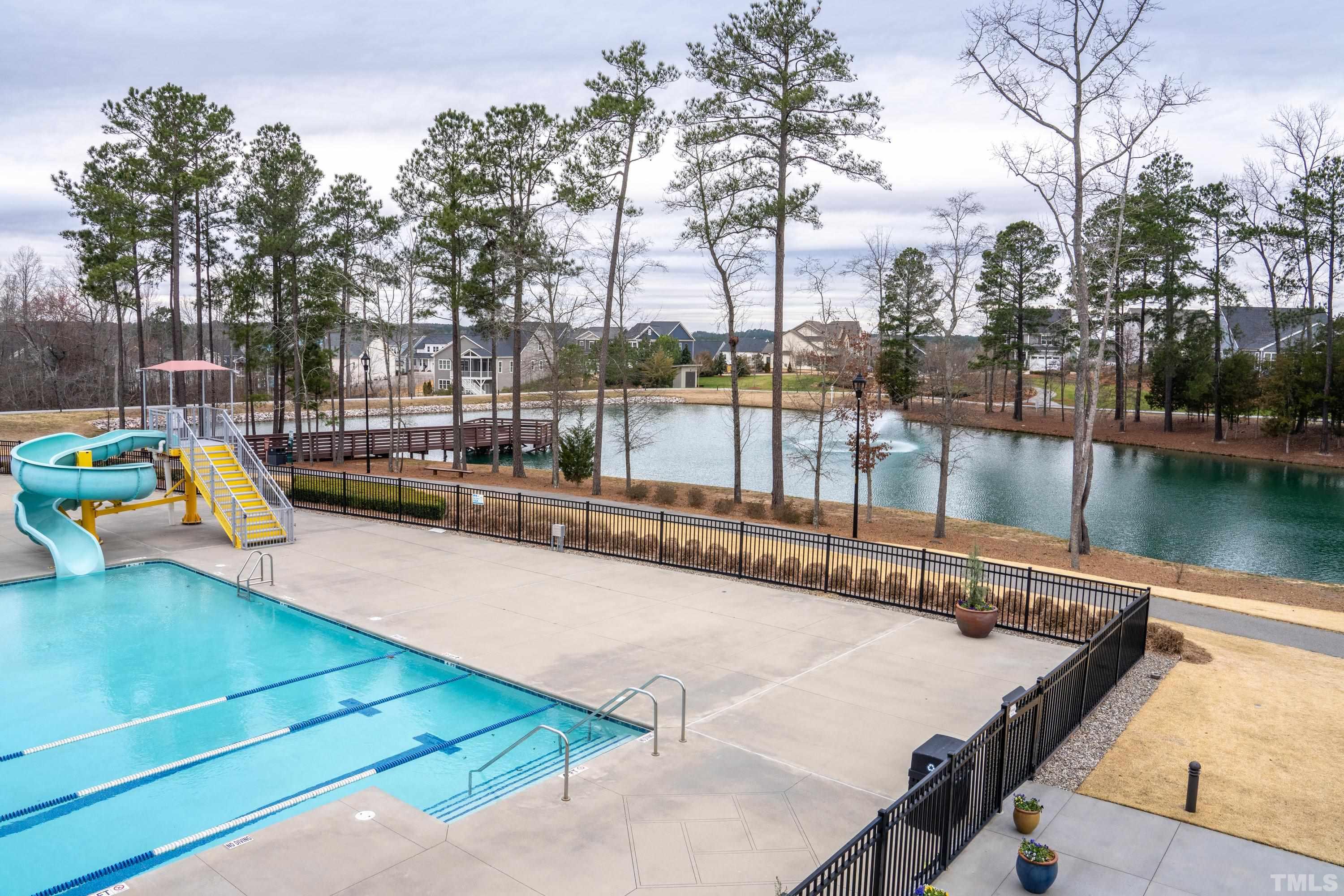 272 Daniel Ridge Road Wendell, NC 27591 - Photo 29 of 39 a view of a swimming pool with a lounge chairs