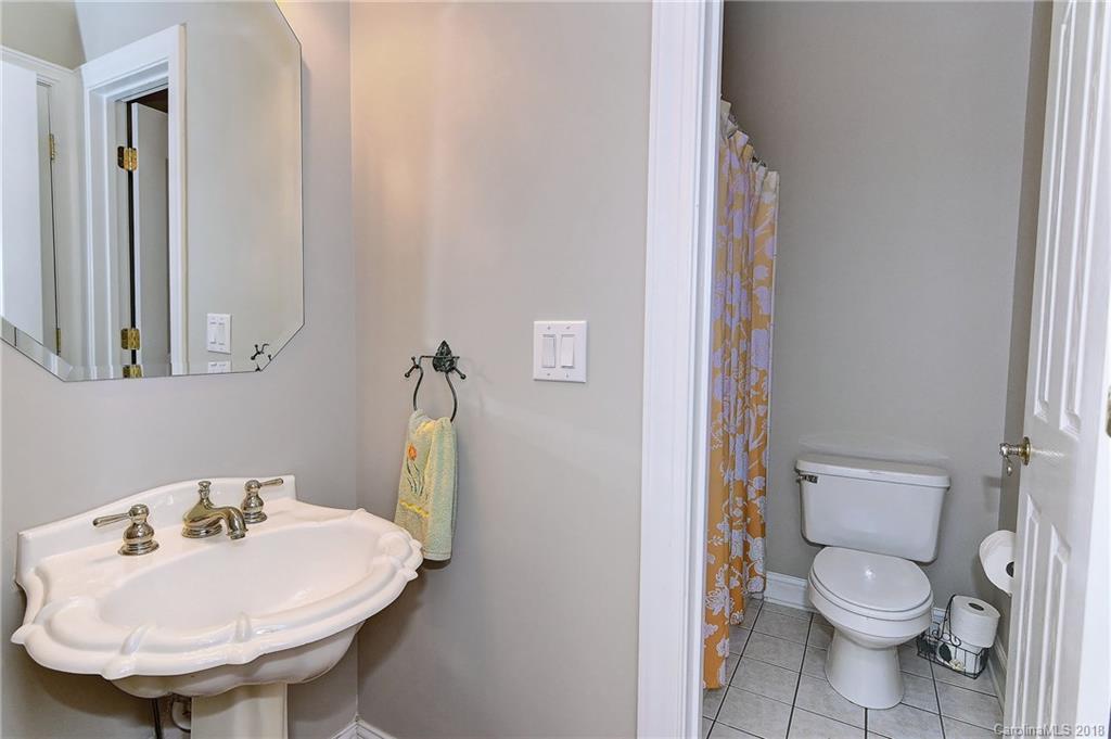 3203 Planters Ridge Road Charlotte, NC 28270 - Photo 12 of 36 a bathroom with a sink toilet and a mirror