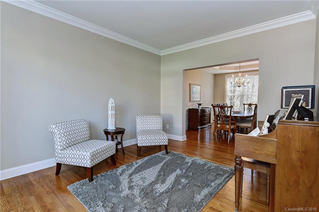 3203 Planters Ridge Road Charlotte, NC 28270 - Photo 14 of 36 a living room with furniture and wooden floor