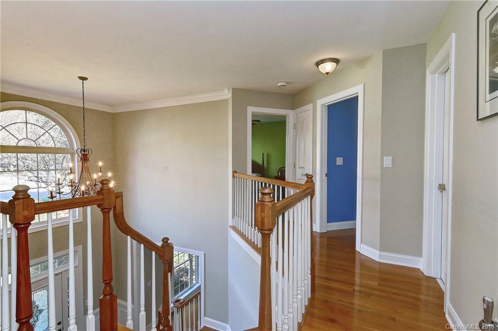 3203 Planters Ridge Road Charlotte, NC 28270 - Photo 17 of 36 a view of a hallway with wooden floor and staircase