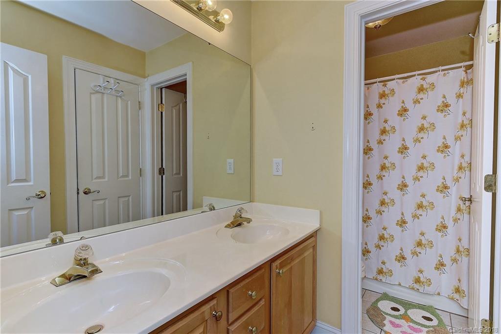 3203 Planters Ridge Road Charlotte, NC 28270 - Photo 24 of 36 a bathroom with a sink and a mirror