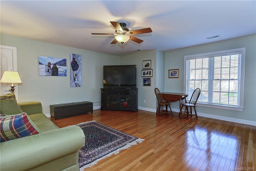 3203 Planters Ridge Road Charlotte, NC 28270 - Photo 26 of 36 a living room with furniture and a flat screen tv