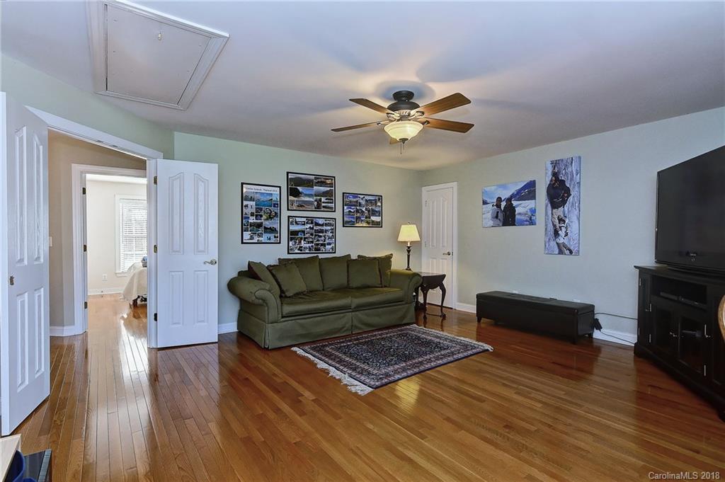3203 Planters Ridge Road Charlotte, NC 28270 - Photo 27 of 36 a living room with furniture and a flat screen tv