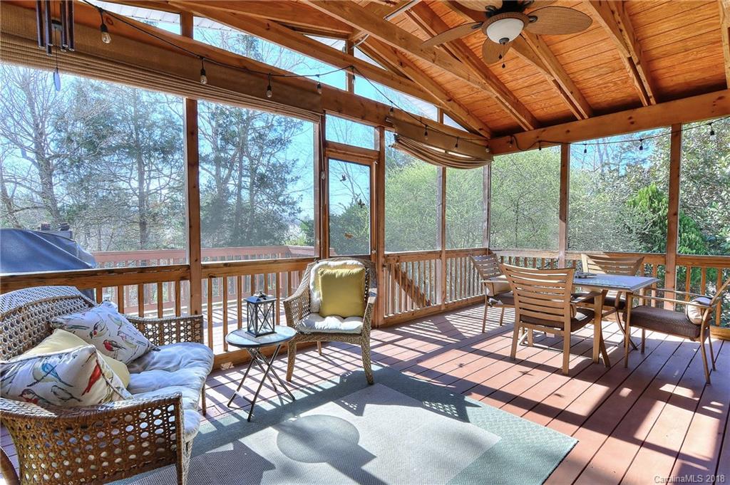 3203 Planters Ridge Road Charlotte, NC 28270 - Photo 28 of 36 a view of a patio with a dining table chairs and a glass door