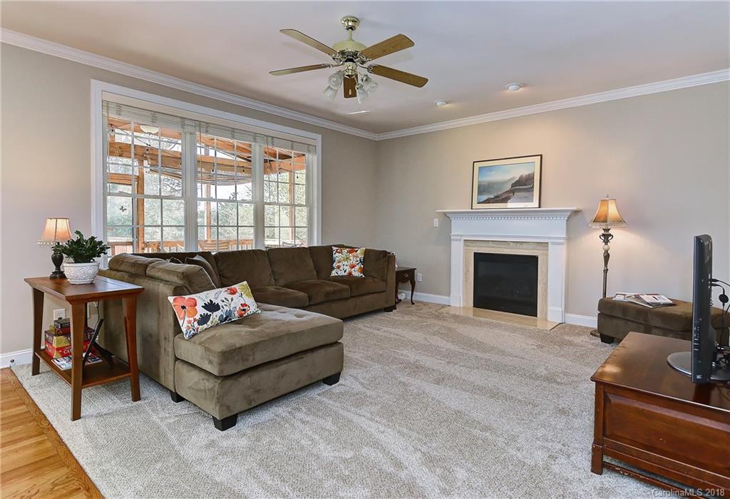 3203 Planters Ridge Road Charlotte, NC 28270 - Photo 8 of 36 a living room with furniture and a fireplace