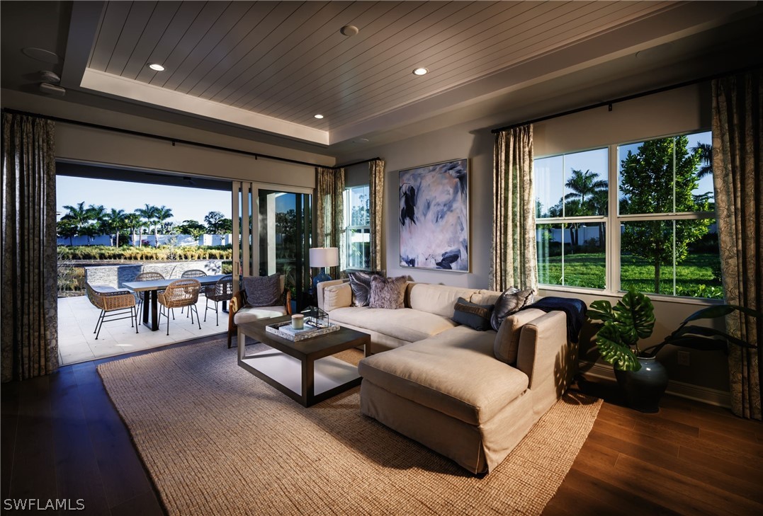 14831 Loggerhead Drive Naples, FL 34120 - Photo 2 of 10 a living room with furniture and a large window