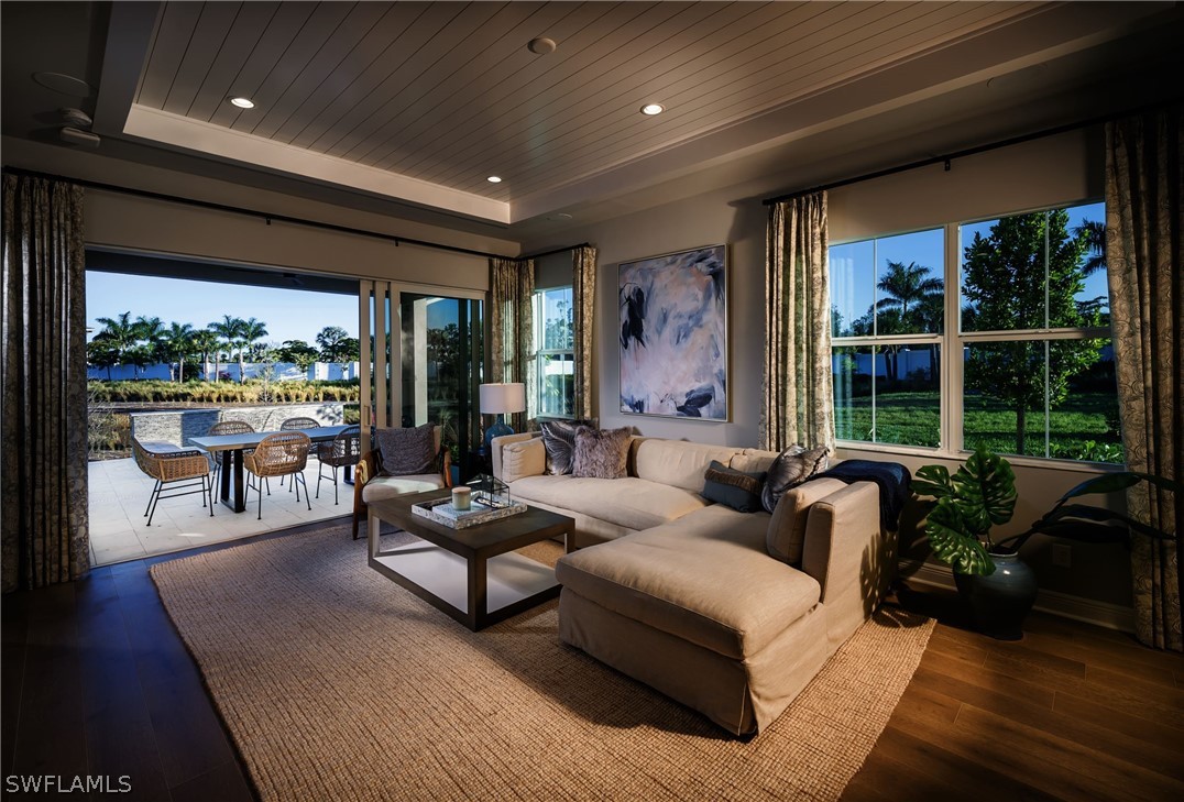 14831 Loggerhead Drive Naples, FL 34120 - Photo 5 of 10 a living room with furniture and a large window