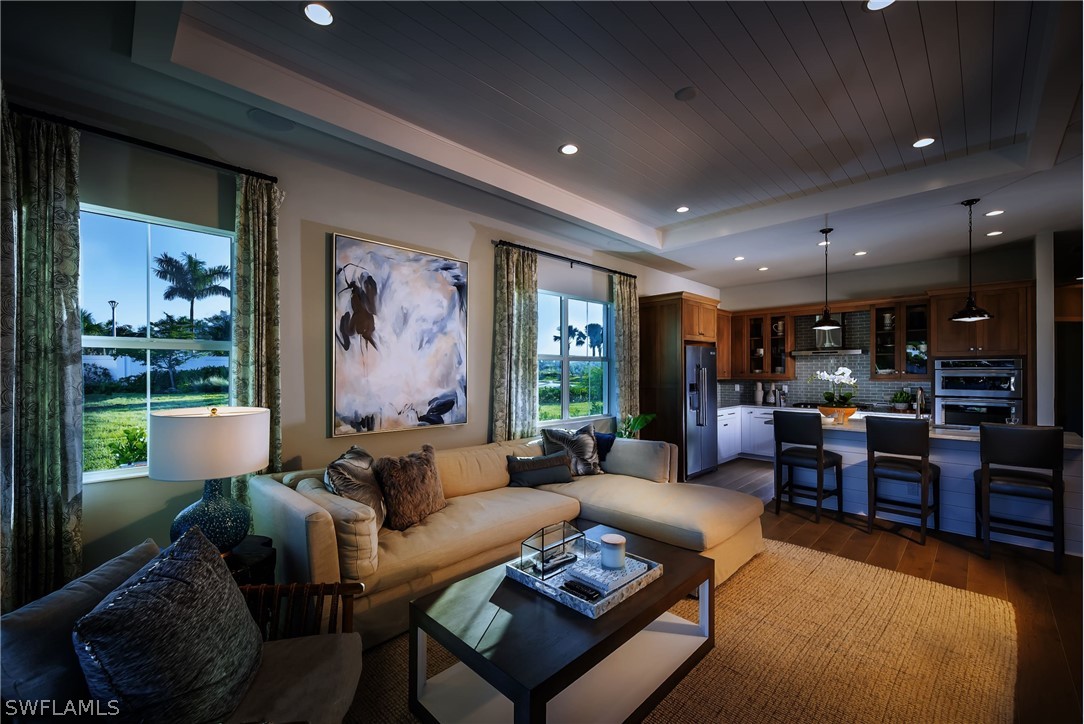 14831 Loggerhead Drive Naples, FL 34120 - Photo 6 of 10 a living room with furniture and a large window