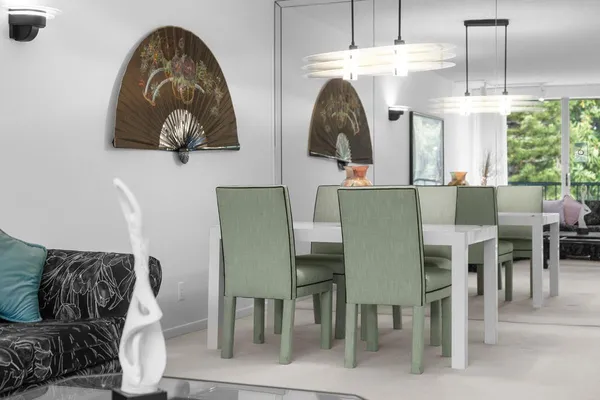a dining room with furniture and window