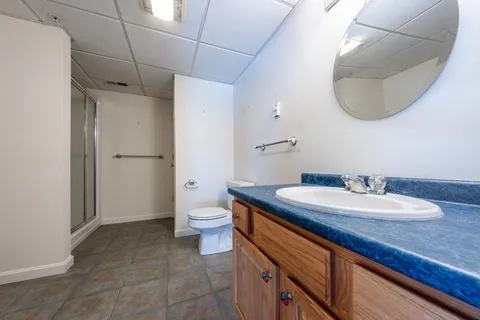a view of balcony with wooden floor and fence
