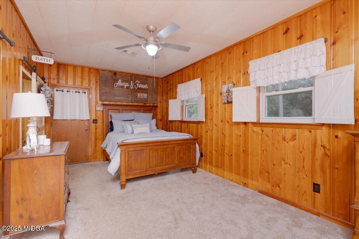 150 Moss Oaks Road Perry, GA 31069 - Photo 25 of 51 a spacious bedroom with a bed and window