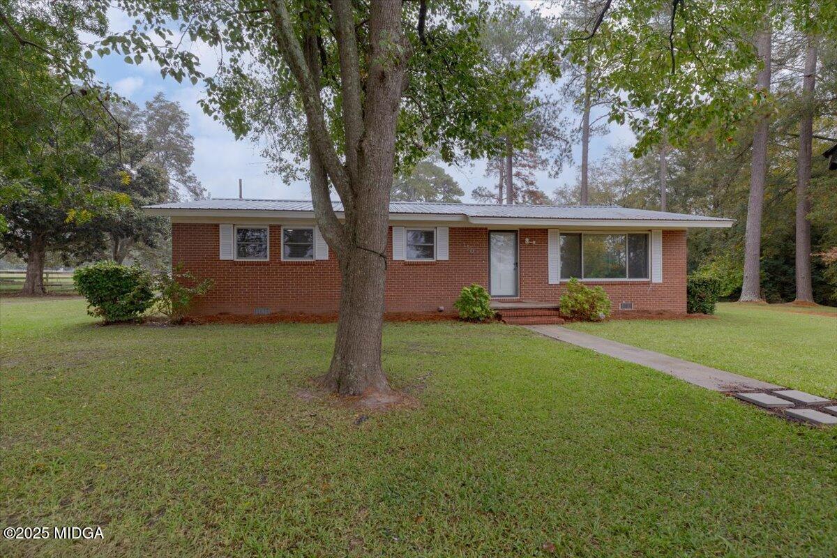 150 Moss Oaks Road Perry, GA 31069 - Photo 3 of 51 a front view of house with yard and green space