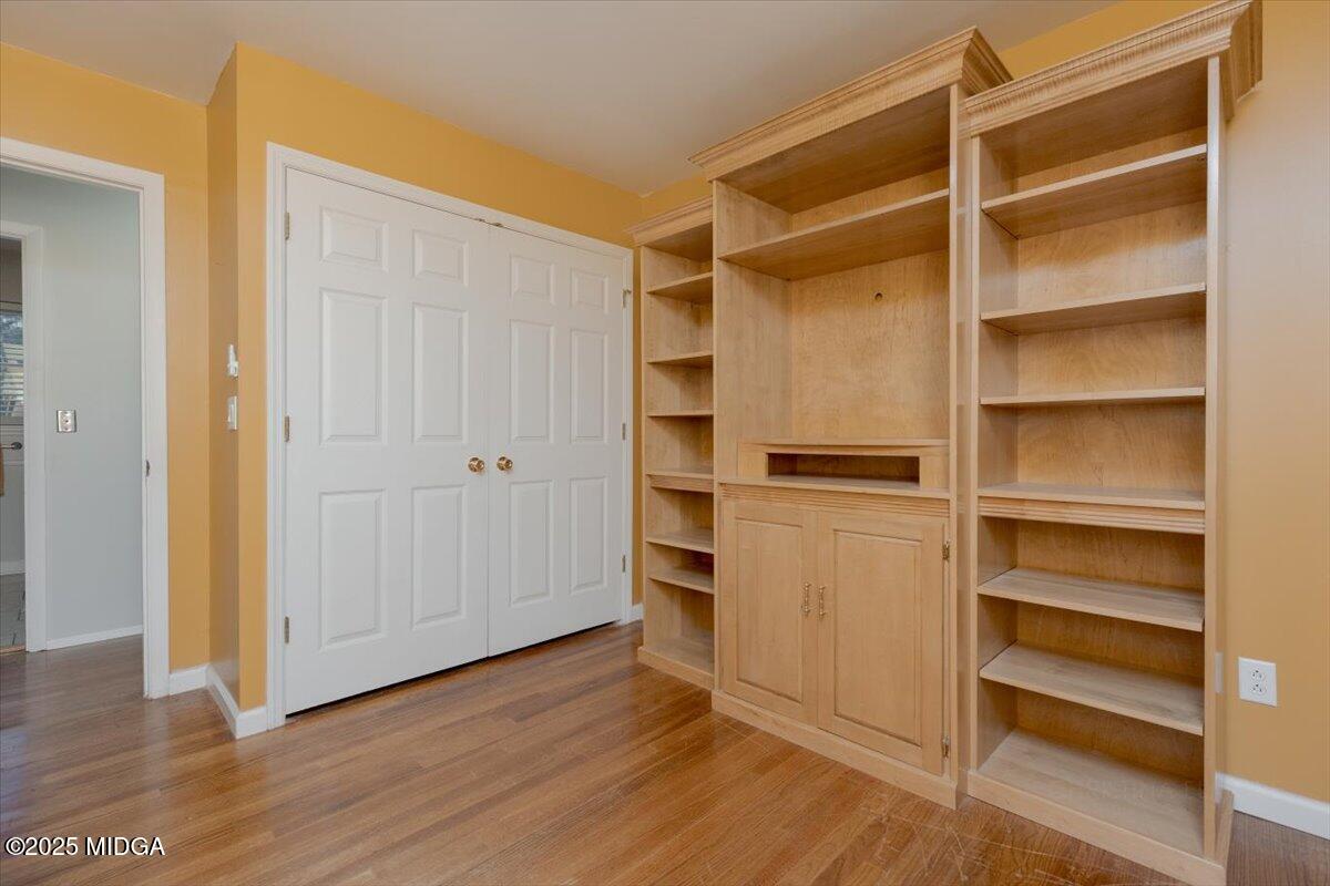 150 Moss Oaks Road Perry, GA 31069 - Photo 39 of 51 a view of walk in closet with empty racks