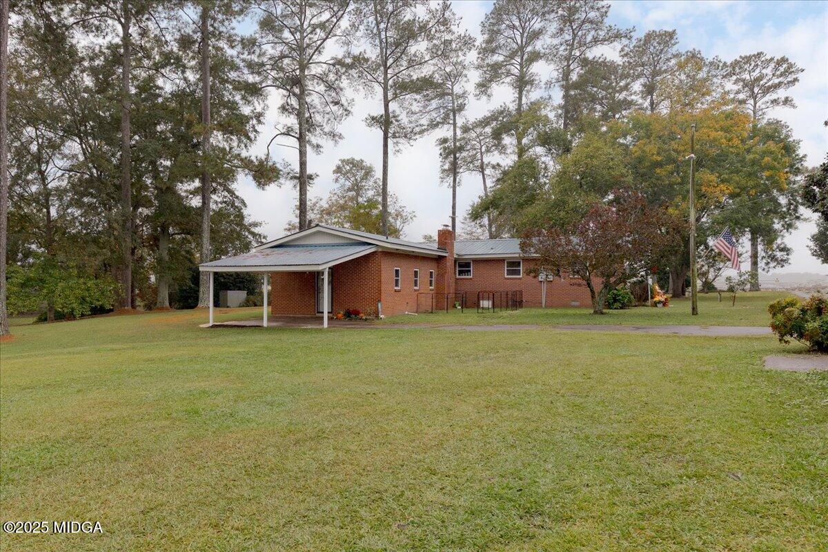 150 Moss Oaks Road Perry, GA 31069 - Photo 41 of 51 a view of a house with a yard