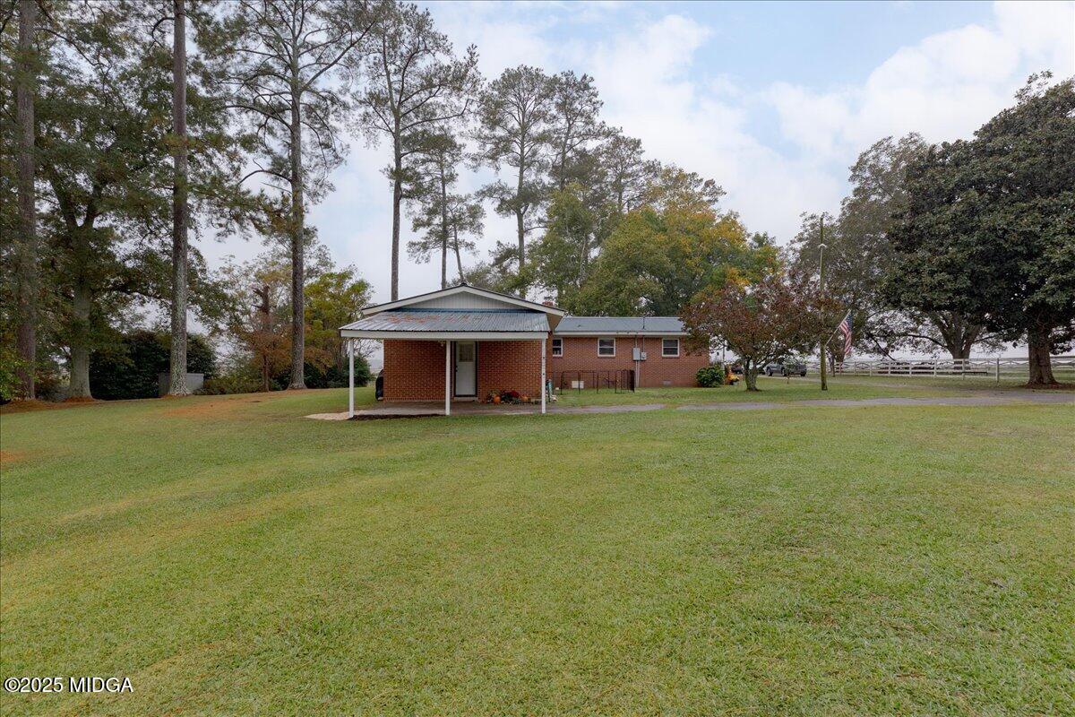 150 Moss Oaks Road Perry, GA 31069 - Photo 42 of 51 a front view of a house with garden