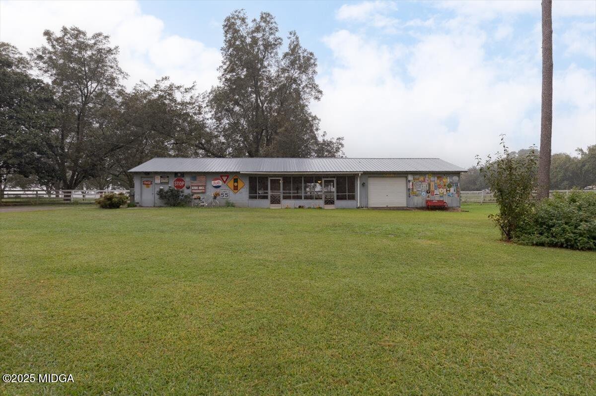 150 Moss Oaks Road Perry, GA 31069 - Photo 44 of 51 a view of a house with a big yard and large trees