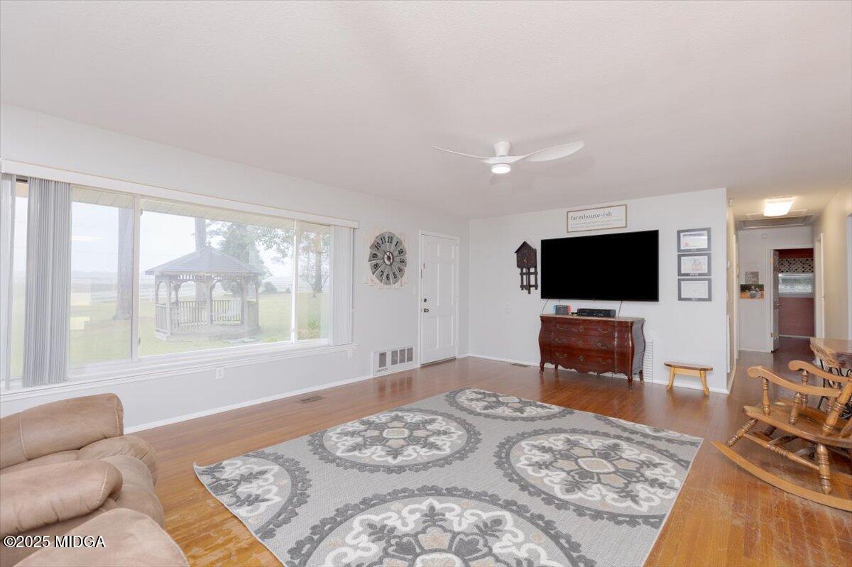 150 Moss Oaks Road Perry, GA 31069 - Photo 10 of 51 a living room with furniture and a flat screen tv