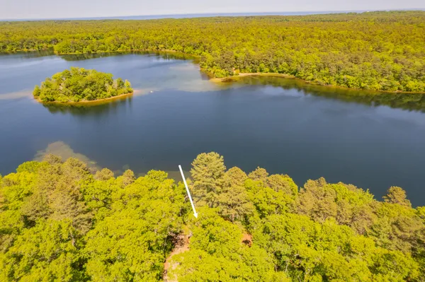 a view of a lake with a yard
