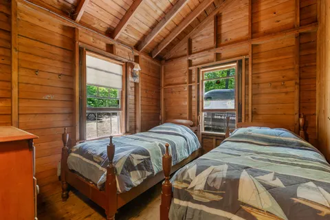 a bedroom with furniture and a window