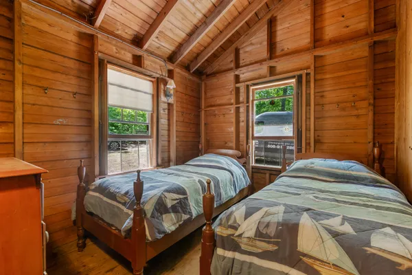 a bedroom with furniture and a window